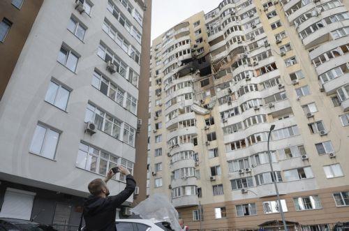 epa12159491 A local man looks at the site of a high-rise residential building struck by a drone during a massive overnight attack in Kyiv, Ukraine, 06 June 2025, amid the ongoing Russian invasion. At least three people were killed and more than 40 injured after Russia launched a large-scale combined assault using at least 44 missiles and nearly 407 drones...