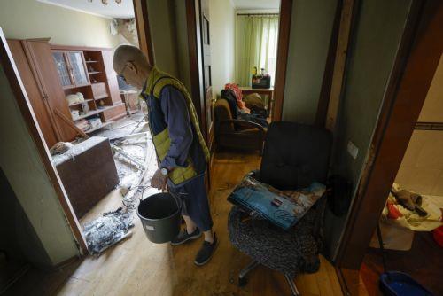 epa12159492 A local man clean debris at the site of a high-rise residential building struck by a drone during a massive overnight attack in Kyiv, Ukraine, 06 June 2025, amid the ongoing Russian invasion. At least three people were killed and more than 40 injured after Russia launched a large-scale combined assault using at least 44 missiles and nearly 407...
