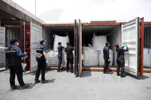epa12167599 Thai Customs accompany Department of Industrial Works (DIW) officials examining confiscated hazardous Electric Arc Furnace (EAF) Dust or 'red dust' hidden inside shipping containers at the Customs X-Ray and Technology Center, Bangkok Port Customs Office in Bangkok, Thailand, 10 June 2025. Thai authorities seized 736 tons of Electric Arc Furnace...