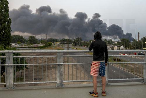 epa12167612 A local man watches clouds of smoke rise above the Ukrainian capital following an overnight attack in Kyiv, Ukraine, 10 June 2025, amid the ongoing Russian invasion. At least two people were killed and a dozen more injured after Russia launched a large-scale combined assault across Ukraine, according to the State Emergency Service (SES). ...