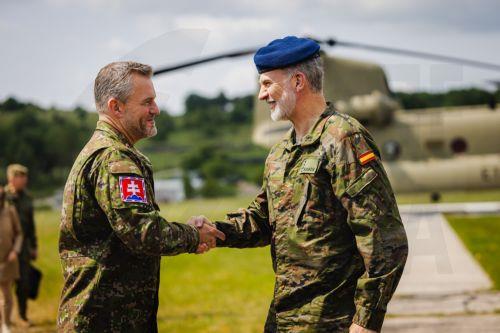 epa12169863 A handout photo made available by the Office of the President of the Slovak Republic shows King Felipe VI of Spain (R) and Slovak President Peter Pellegrini shaking hands during their visit to the NATO multinational battle group led by the Spanish contingent at Lest Training Centre near Pliesovce, Slovakia, 11 June 2025. The Spanish king is on a...