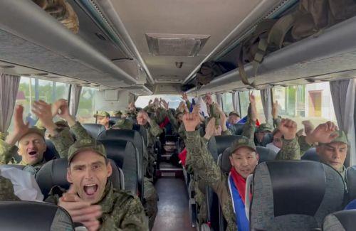 epa12171598 A still image taken from a handout video provided by the Russian Defense Ministry press-service shows Russian servicemen celebrating inside a bus after being released in a prisoners swap between Russia and Ukraine, at an unspecified location in Belarus, 12 June 2025. The Russian Defense Ministry announced that as a result of the negotiation...