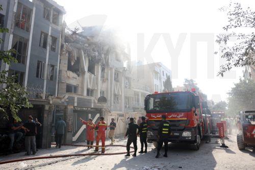 epa12172799 Fire fighters, rescue workers and security personnel work around a building that was hit by Israeli air strikes in central Tehran, Iran, 13 June 2025. Israel confirms it has launched strikes on Iran's 'nuclear program' as blasts are heard across the country. The strikes are part of Operation Rising Lion, Israel's Prime Minister Benjamin...