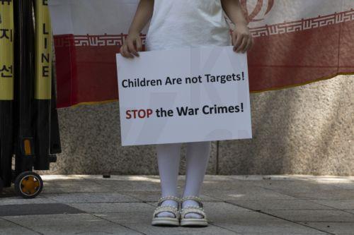 epa12190492 Iranians living in South Korea during a rally against US and Israeli attacks on Iran, near the Israel embassy in Seoul, South Korea, 22 June 2025. The US bombed three of Iran's nuclear sites in Fordow, Natanz, and Esfahan while Israel and Iran have been exchanging fire since Israel launched strikes across Iran on 13 June 2025 as part of...