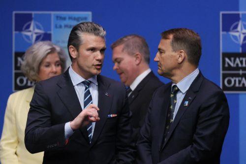 epa12196402 Poland's Foreign Minister Radoslaw Sikorski (R) and U.S. Defense Secretary Pete Hegseth (2-L) attend the NATO summit in The Hague, Netherlands, 25 June 2025. The Netherlands, for the first time in NATO's history of existence, is hosting a NATO summit.  EPA/PAWEL SUPERNAK POLAND OUT