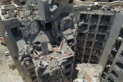 epa12196509 Damaged buildings at the site of an Iranian missile strike that hit a residential area on 24 June, in Be'er Sheva, southern Israel, 25 June 2025, during a US-mediated ceasefire between Iran and Israel. Magen David Adom (MDA), Israel's national emergency services, reported at least 28 killed and hundreds injured in Iranian retaliatory attacks...