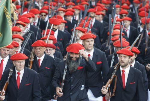 epa12205770 Participants attend the traditional 'Alarde' parade during festivities in the town of Irun, Basque Country, northern Spain, 30 June 2025. The parade commemorates the victory of Irun's troops over French invaders on 30 June 1522. Each year, residents dressed as members of the infantry, lumberjacks, sappers, and a military band take part in the...