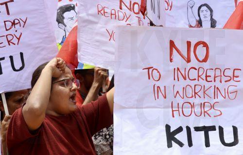 epa12226111 Members of the All India United Trade Union Centre (AIUTUC), Centre of Indian Trade Unions (CITU), and other trade union organisations hold placards and shout slogans during a nationwide general strike, or 'Bharat Bandh', to oppose the 'anti-worker, anti-farmer, and anti-national' pro-corporate policies in Bangalore, India, 09 July 2025. Over a...