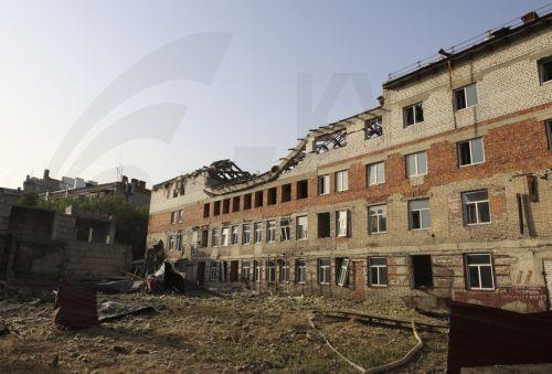 epa12231053 The site of a drone strike in Kharkiv, Ukraine, 11 July 2025, amid the Russian invasion. At least nine people were injured the morning in a Russian drone attack on downtown Kharkiv, according to the State Emergency Service (SES).  EPA/SERGEY KOZLOV