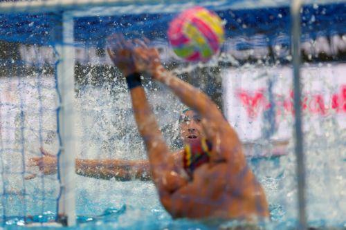 epa12237107 Aguirre Unai (C) of Spain in action against Berehulak Marcus (L) of Australia during the men's water polo match between Australia and Spain at the World Aquatics Championships Singapore 2025 in Singapore, 14 July 2025.  EPA/FAZRY ISMAIL