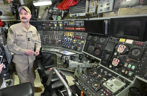 epa12271801 Crew members are seen in the control station aboard the USS Ohio, the first Ohio-class submarine to dock at the Port of Brisbane, Australia, July 30, 2025. The USS Ohio, a nuclear-powered guided-missile submarine with 150 crew members, is visiting Brisbane.  EPA/DARREN ENGLAND NO ARCHIVING AUSTRALIA AND NEW ZEALAND OUT