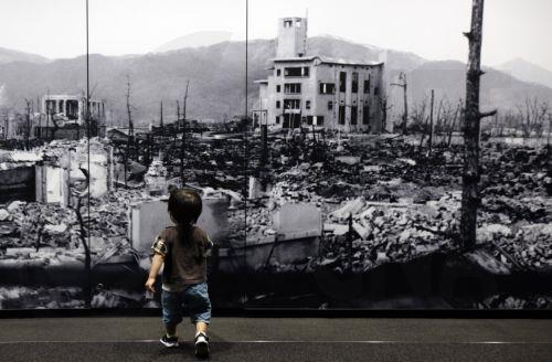 epa12283777 A young boy walks toward a huge picture of Hiroshima devastated by the world's first atomic bombing at the Hiroshima Peace Memorial Museum in Hiroshima, western Japan, 05 August 2025. 06 August 2025 will mark the 80th anniversary of the bombing of Hiroshima. In 1945, the United States dropped two nuclear bombs over the cities of Hiroshima and...