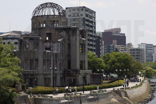 epa12283781 People walk past the A-Bomb Dome at the Peace Memorial Park in Hiroshima, western Japan, 05 August 2025. 06 August 2025 will mark the 80th anniversary of the bombing of Hiroshima. In 1945, the United States dropped two nuclear bombs over the cities of Hiroshima and Nagasaki on 06 and 09 August respectively, killing more than 200,000 people. ...