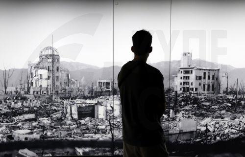epa12283787 A visitor looks at a huge picture of Hiroshima devastated by the world's first atomic bombing at the Hiroshima Peace Memorial Museum in Hiroshima, western Japan, 05 August 2025. 06 August 2025 will mark the 80th anniversary of the bombing of Hiroshima. In 1945, the United States dropped two nuclear bombs over the cities of Hiroshima and Nagasaki...