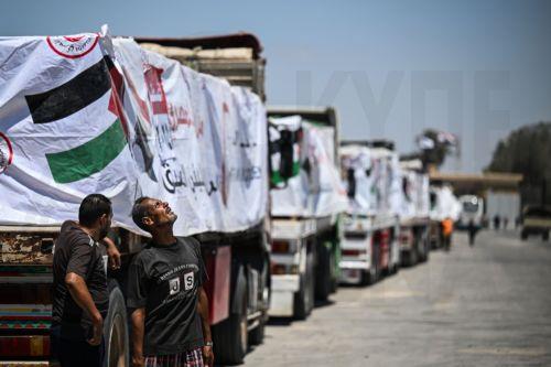 epa12286323 Drivers stand next to trucks loaded with humanitarian aid bound for the Gaza Strip wait at the Rafah Border gate, between Egypt and the Gaza Strip, Rafah, North Sinai Governorate, Egypt, 06 August 2025.  EPA/MOHAMED HOSSAM