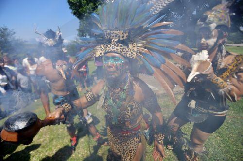 epa12292990 Members of a pre-Hispanic cultural group participate in a ritual prior to the re-enactment of a ball game as part of International Day of Indigenous Peoples at the Guachimontones archaeological site in Teuchitlan, Mexico, 10 August 2025. The Purepecha people, originally from the state of Michoacan, faced off against the Tecuexes from Jalisco...