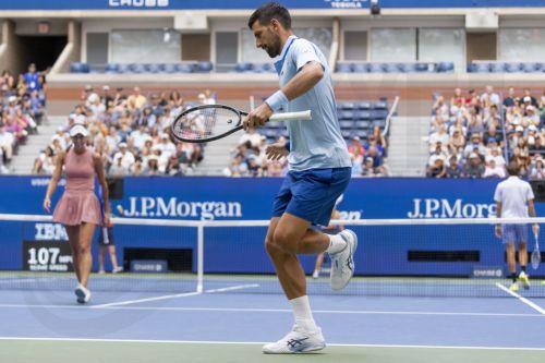epa12311169 Novak Djokovic of Serbia (R) dances after a winning shot while playing with Olga Danilovic of Serbia (L) against Daniil Medvedev and Mirra Andreeva of Russia in their mixed doubles match during the US Open Tennis Championships at the USTA Billie Jean King National Tennis Center in Flushing Meadows, New York, USA, 19 August 2025.  EPA/JUSTIN LANE