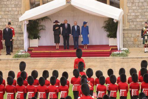 epa12384677 A handout photo made available by the British Ministry of Defence shows (L-R) US First Lady Melania Trump, US President Donald J. Trump, Britain's King Charles III and Queen Camilla as they review the Guard of Honour during the state visit by the US president at Windsor Castle in Windsor, Britain, 17 September 2025. Britain's King Charles III is...