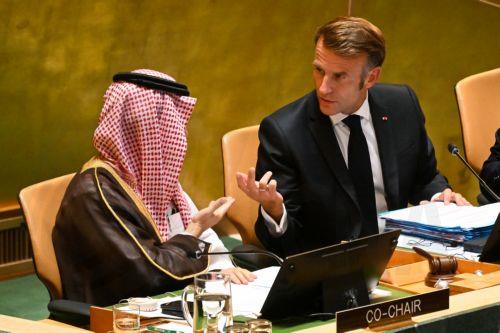 epaselect epa12398990 Predident of France Emmanuel Macron (R) speaks to Saudi Foreign Minister Prince Faisal bin Farhan (L) during the High-Level International Conference for the Peaceful Settlement of the Question of Palestine and the Implementation of the Two-State Solution, at the United Nations (UN) headquarters in New York, New York, USA, 22 September...