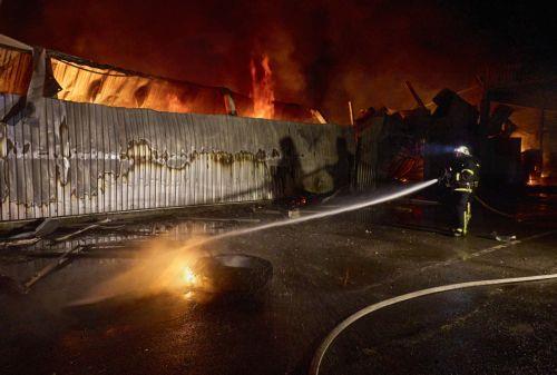 epa12401240 Ukrainian rescuers work at the site of shelling in Kharkiv, northeastern Ukraine, 23 September 2025 (issued 24 September 2025), amid the Russian invasion. Civilian infrastructure objects were damaged or destroyed during Russian overnight shelling, according to the head of the Kharkiv Military Administration, Oleg Synegubov. At least one person...