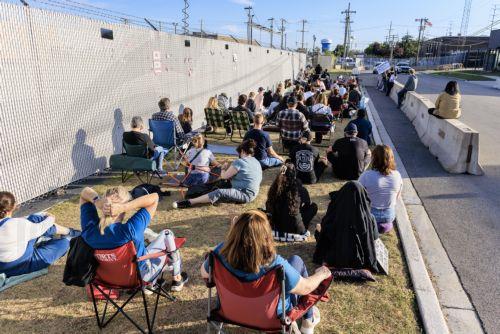 epa12449601 Activists attend a silent demonstration outside the ICE detention facility in Broadview, around 12 miles west of Chicago, Illinois, USA, 12 October 2025. The demonstrations against the US Immigration and Customs Enforcement (ICE) are rooted in concerns about civil rights, local community safety, and alleged overreach by federal enforcement. ...