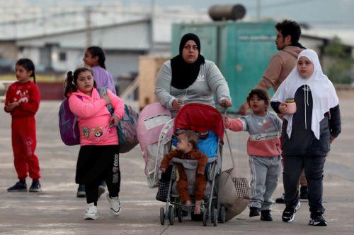 epa12454709 Syrian refugees gather as they prepare to return home to Syria in Beirut, Lebanon, 15 October 2025. The Lebanese government, in coordination with the United Nations High Commissioner for Refugees (UNHCR), conducted the fifth phase of the organized departure of Syrian refugees back to their homeland. According to Lebanese General Security, over...