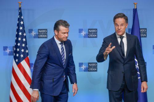 epa12454809 NATO Secretary General Mark Rutte (R) welcomes US Secretary of War Pete Hegseth before NATO Ministers of Defence meeting in Brussels, Belgium, 15 October 2025. The meeting of the North Atlantic Council in Defence Ministers' Session will be followed by a Ukraine Contact Group meeting.  EPA/OLIVIER HOSLET