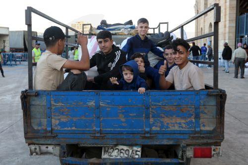 epaselect epa12454702 Syrian refugees gather as they prepare to return home to Syria in Beirut, Lebanon, 15 October 2025. The Lebanese government, in coordination with the United Nations High Commissioner for Refugees (UNHCR), conducted the fifth phase of the organized departure of Syrian refugees back to their homeland. According to Lebanese General...