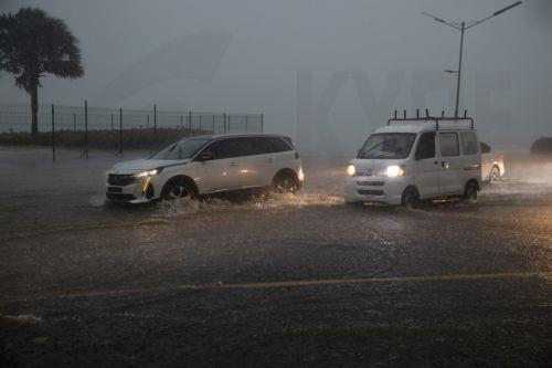 epa12471604 Vehicles travel through a flooded street in Santo Domingo, Dominican Republic, 21 October 2025. The Dominican Republic activated emergency plans in response to heavy rainfall forecast from Tropical Storm Melissa, which formed in the Caribbean Sea and triggered warnings for the Dominican Republic, Haiti, and Jamaica.  EPA/ORLANDO BARRIA