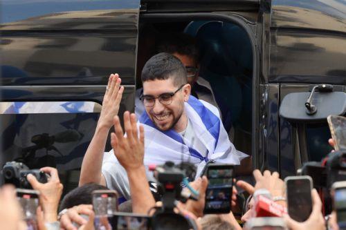 epa12483939 Released Israeli hostage Evyatar David waves to crowds as he returns to his home after completing hospitalization and treatment period, in Kfar Sava, Israel, 26 October 2025. Evyatar David was kidnapped by Hamas from the Nova music festival at the Gaza border 07 October 2023 and released during a ceasefire agreement between Hamas and Israel. The...