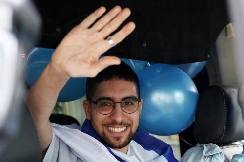 epa12483940 Released Israeli hostage Evyatar David waves to crowds as he returns to his home after completing hospitalization and treatment period, in Kfar Sava, Israel, 26 October 2025. Evyatar David was kidnapped by Hamas from the Nova music festival at the Gaza border 07 October 2023 and released during a ceasefire agreement between Hamas and Israel. The...