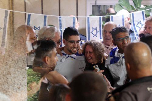 epa12483942 Released Israeli hostage Evyatar David hugs with family members as he returns to his home after completing hospitalization and treatment period, in Kfar Sava, Israel, 26 October 2025. Evyatar David was kidnapped by Hamas from the Nova music festival at the Gaza border 07 October 2023 and released during a ceasefire agreement between Hamas and...