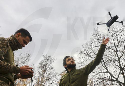 epa12490822 Servicemen of the special unit of the 72nd Separate Brigade named after the Black Zaporozhians assemble and train to fly drones before combat use on the front line, in a undisclosed location, in the Kharkiv region, Ukraine, 29 October 2025, amid the ongoing Russian invasion.  EPA/SERGEY KOZLOV