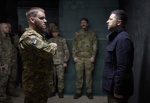epa12502403 A handout photo made available by the Ukrainian Presidential Press Service shows Ukraine's President Volodymyr Zelensky hands awards to servicemen during his working visit to the frontline in the Donetsk region, eastern Ukraine, 04 November 2025, amid the Russian invasion. The Ukrainian president met with the military at the command post of the...