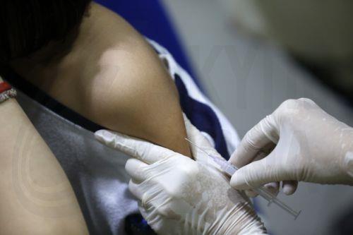 epa12506909 A student (L) receives diphtheria and tetanus immunization injections during the School Children Immunization Month (BIAS) program at Methodist School, in Banda Aceh, Indonesia, 06 November 2025. School immunization programs are conducted by schools in collaboration with the Public Health Service Center to increase immunity and prevent several...