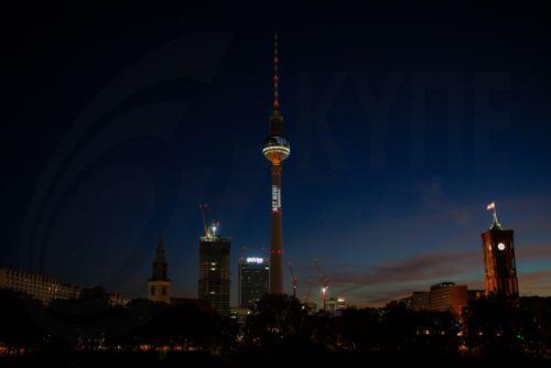 epa12506971 Activists from the environmental protest organization Greenpeace demonstrate with a projection onto the TV Tower in Berlin, Germany, 06 November 2025. Ahead of the World Climate Conference 'COP30', taking place in Brazil, Greenpeace activists projected a burning globe and the slogan 'Act Now!' onto the TV Tower.  EPA/CLEMENS BILAN