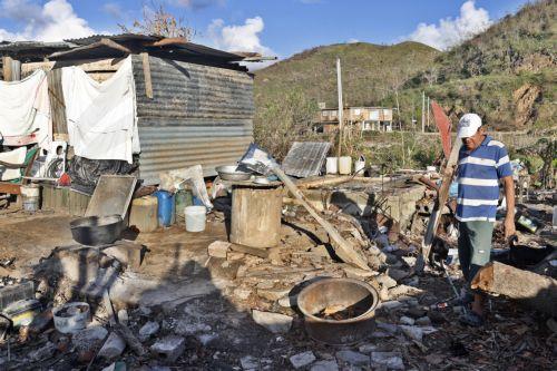 epa12511559 A person walks through rubble in El Cobre, Santiago de Cuba province, Cuba, 07 November 2025. The five Cuban provinces severely affected by Hurricane Melissa on 29 October are beginning to gradually restore services, although authorities have warned that the damage is extensive and that normalization will take time.  EPA/ERNESTO MASTRASCUSA