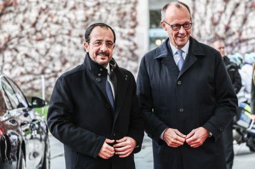 epa12525688 German Chancellor Friedrich Merz (R) greets the Cypriot President Nikos Christodoulides (L) with military honours, at the Federal Chancellery of Germany in Berlin, Germany, 14 November 2025. Christodoulides' visit aims to present to Merz the main pillars of Cyprus's EU presidency program, including EU defense, border management, and support for...