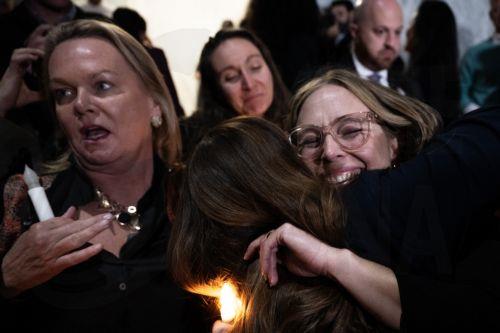 epa12534753 Jeffrey Epstein abuse survivor Annie Farmer (R) celebrates with a hug after the Senate unanimously approved to pass the house bill at the Rayburn House Office Building in Washington, DC, USA, 18 November 2025. The Democratic Women’s Caucus held a vigil in honor of the Jeffrey Epstein abuse survivors in the Rayburn House Office Building foyer....