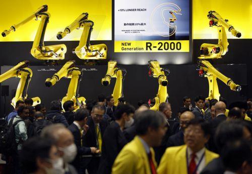 epa12566629 Industrial robots are displayed at the Fanuc booth during the International Robot Exhibition 2025 (iREX2025) in Tokyo, Japan, 03 December 2025. Held once every two years, the iREX is one of the world’s largest robot trade shows. For the 2025 edition, 673 companies and organizations will be presenting their latest robot technologies until 06...
