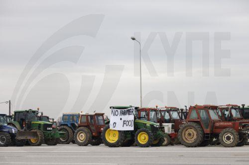 epa12566900 Tractors lined up at the Malgara toll road, as part of a nationwide farmers' mobilization in Thessaloniki, Greece, 03 December 2025. At the Malgara toll station on the Thessaloniki–Athens National Road, farmers from the Municipality of Delta and the surrounding area have been blocking the road to Athens since 01 December, while the road to...