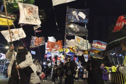 epa12566955 South Korean people participate in a demonstration to mark the first anniversary of the 03 December martial law crisis outside the National Assembly in Seoul, South Korea, 03 December 2025.  EPA/JEON HEON-KYUN