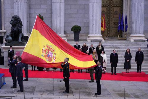 epa12573755 Soldiers and officials participate in a flag-raising ceremony during the celebration of Constitution Day at the Lower House in Madrid, Spain, 06 December 2025. Spain celebrates Constitution Day every year on 06 December, marking the day that its constitution was ratified in 1978.  EPA/Borja Sanchez-Trillo