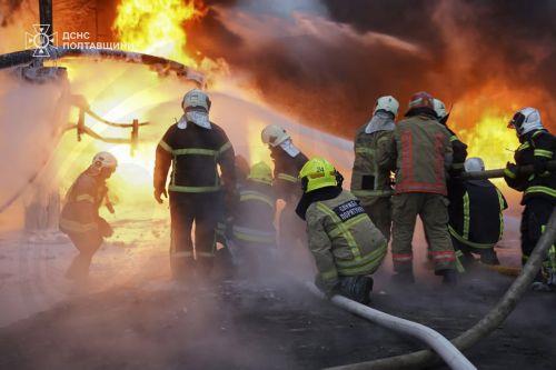 epa12576513 A handout photo made available by the State Emergency Service shows Ukrainian rescuers working at the site of the overnight Russian missile and drone strikes in the Poltava region of Ukraine, 07 December 2025, amid the ongoing Russian invasion. According to Mayor Vitaliy Maletskyi, there were power, heat, and water outages in Kremenchuk city due...