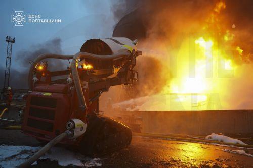 epa12576514 A handout photo made available by the State Emergency Service shows Ukrainian rescuers working at the site of the overnight Russian missile and drone strikes in the Poltava region of Ukraine, 07 December 2025, amid the ongoing Russian invasion. According to Mayor Vitaliy Maletskyi, there were power, heat, and water outages in Kremenchuk city due...
