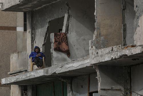 epa12578942 An internally displaced Palestinian man sits in his destroyed house in the Al Sheikh Radwan neighborhood of Gaza City, Gaza Strip, 08 December 2025, amid a ceasefire between Israel and Hamas. Around 1.9 million people in Gaza, nearly 90 percent of the population, have been displaced since the Israel-Hamas conflict began in October 2023,...