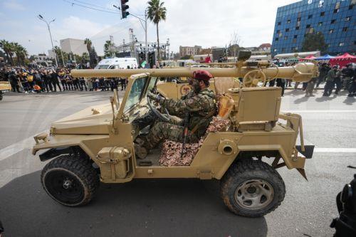 epa12578978 Syrian army soldiers march during a parade marking the first anniversary of the ousting of the Bashar Al-Assad regime in Damascus, Syria, 08 December 2025. Syria marks the first anniversary of the overthrow of the Assad regime on 08 December when the dictatorship of Bashar al-Assad collapsed during a major offensive by opposition forces. ...