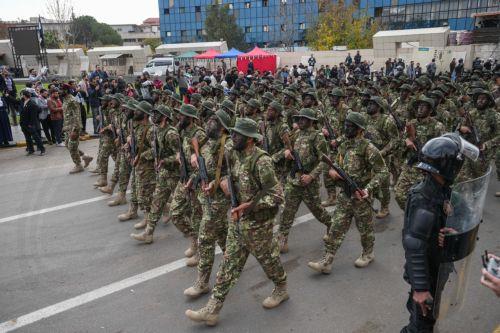 epa12578979 Syrian army soldiers march during a parade marking the first anniversary of the ousting of the Bashar Al-Assad regime in Damascus, Syria, 08 December 2025. Syria marks the first anniversary of the overthrow of the Assad regime on 08 December when the dictatorship of Bashar al-Assad collapsed during a major offensive by opposition forces. ...