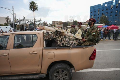 epa12578980 Syrian army soldiers march during a parade marking the first anniversary of the ousting of the Bashar Al-Assad regime in Damascus, Syria, 08 December 2025. Syria marks the first anniversary of the overthrow of the Assad regime on 08 December when the dictatorship of Bashar al-Assad collapsed during a major offensive by opposition forces. ...