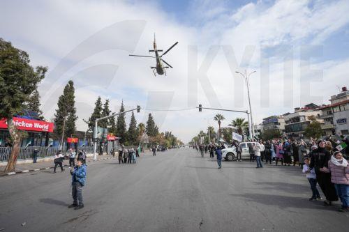 epa12578985 A Syrian army helicopter flies during a parade marking the first anniversary of the ousting of the Bashar al-Assad regime, in Damascus, Syria, 08 December 2025. Syria marks the first anniversary of the overthrow of the Assad regime on 08 December when the dictatorship of Bashar al-Assad collapsed during a major offensive by opposition forces. ...